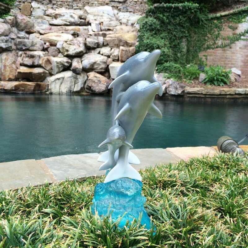 cement dolphin statue